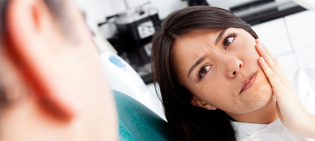 Female patient having toothache