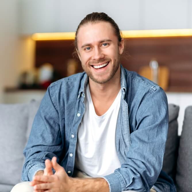 Stylish young man in denim shirt