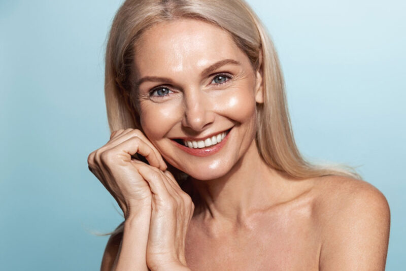 Elegant middle aged woman with glowing skin