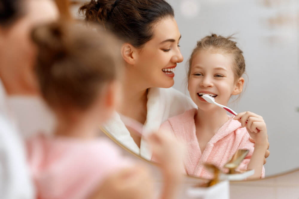 Happy family brushing teeth