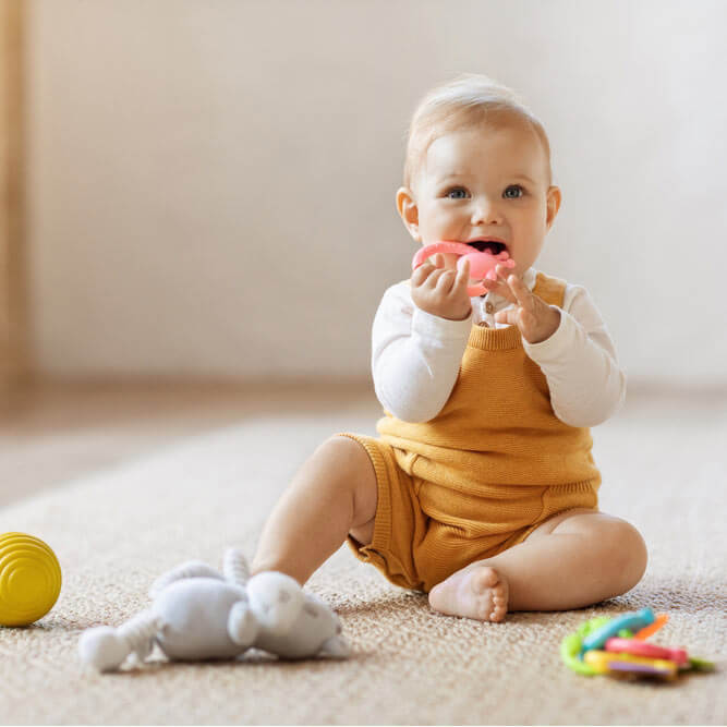 Happy cute baby playing with kids toys