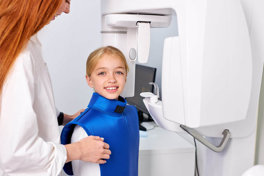 child girl patient doing panoramic teeth x-ray