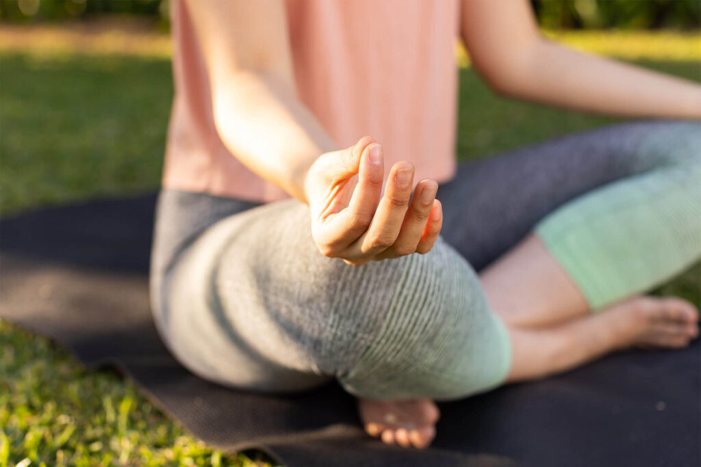 Meditating on yoga mat