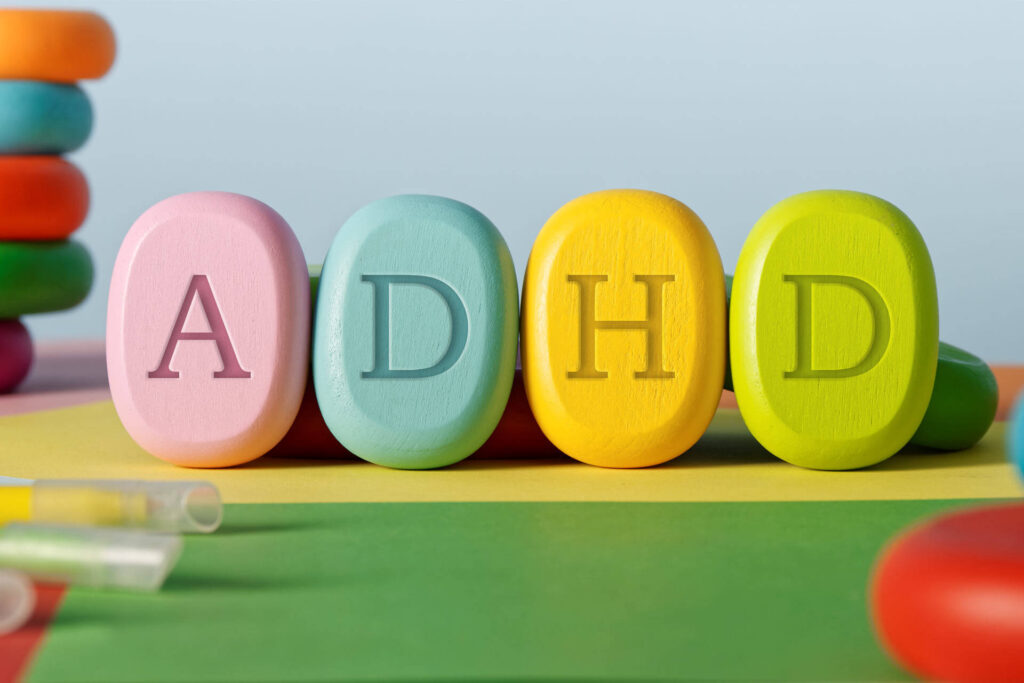 Letters ADHD written on colorful toy blocks