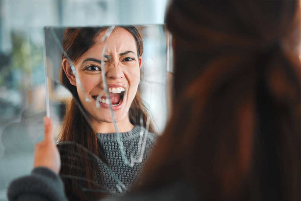 Mirror, broken and mental health with reflection of woman for bipolar