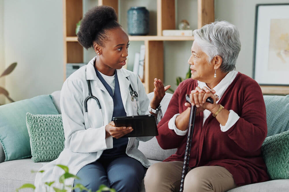 Elderly, woman and doctor with tablet for consultation