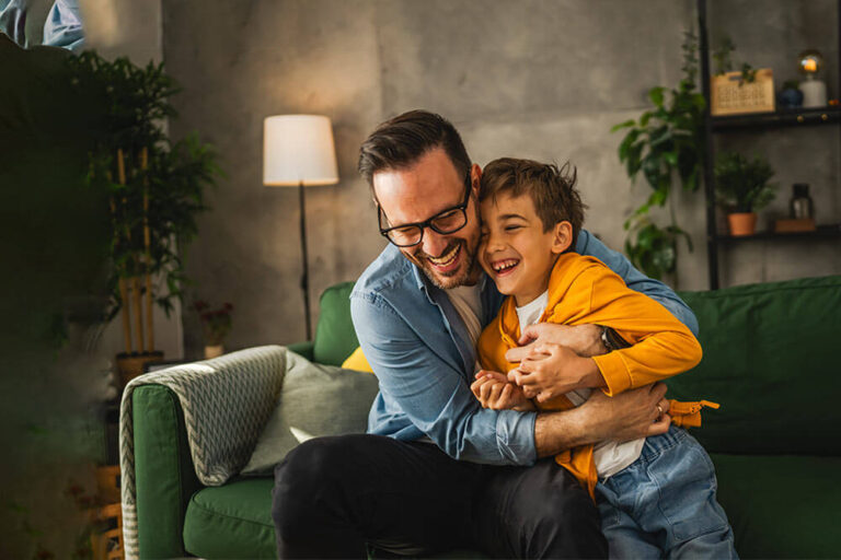 Dad and son tickle and have fun at home