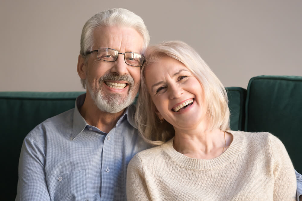 Pretty couple sitting on couch at home