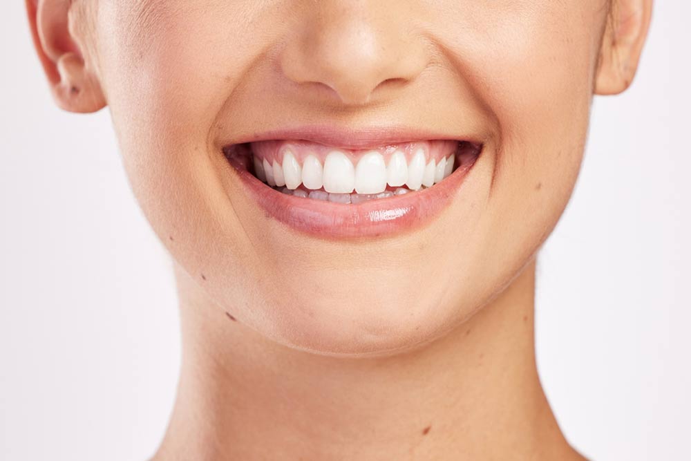 Woman, mouth and teeth in studio for oral health