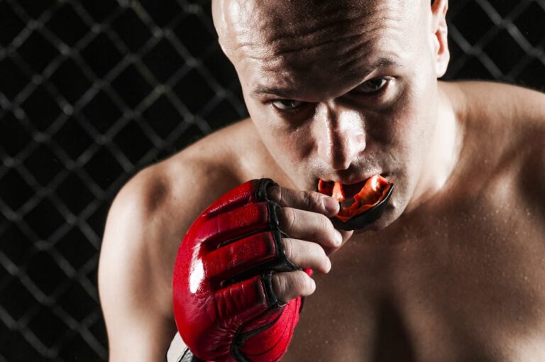 The Fighter applying Sports Mouth Guard