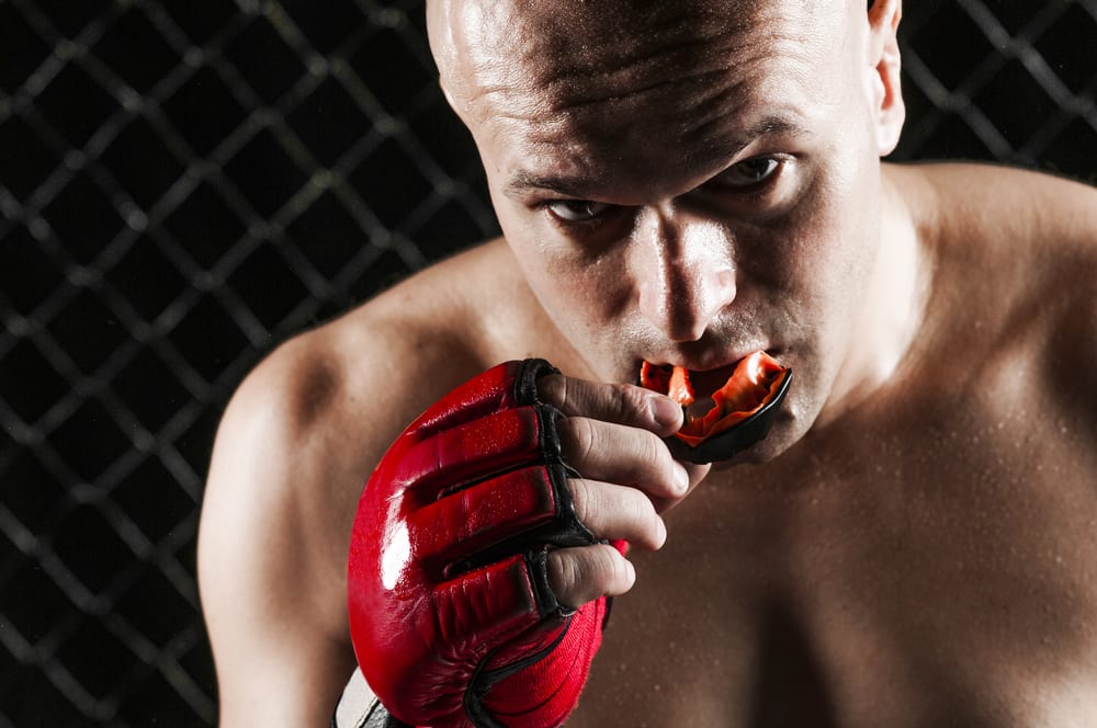 The Fighter applying Sports Mouth Guard