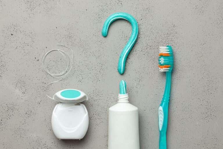 Toothpaste in the form of a question mark and toothbrushes