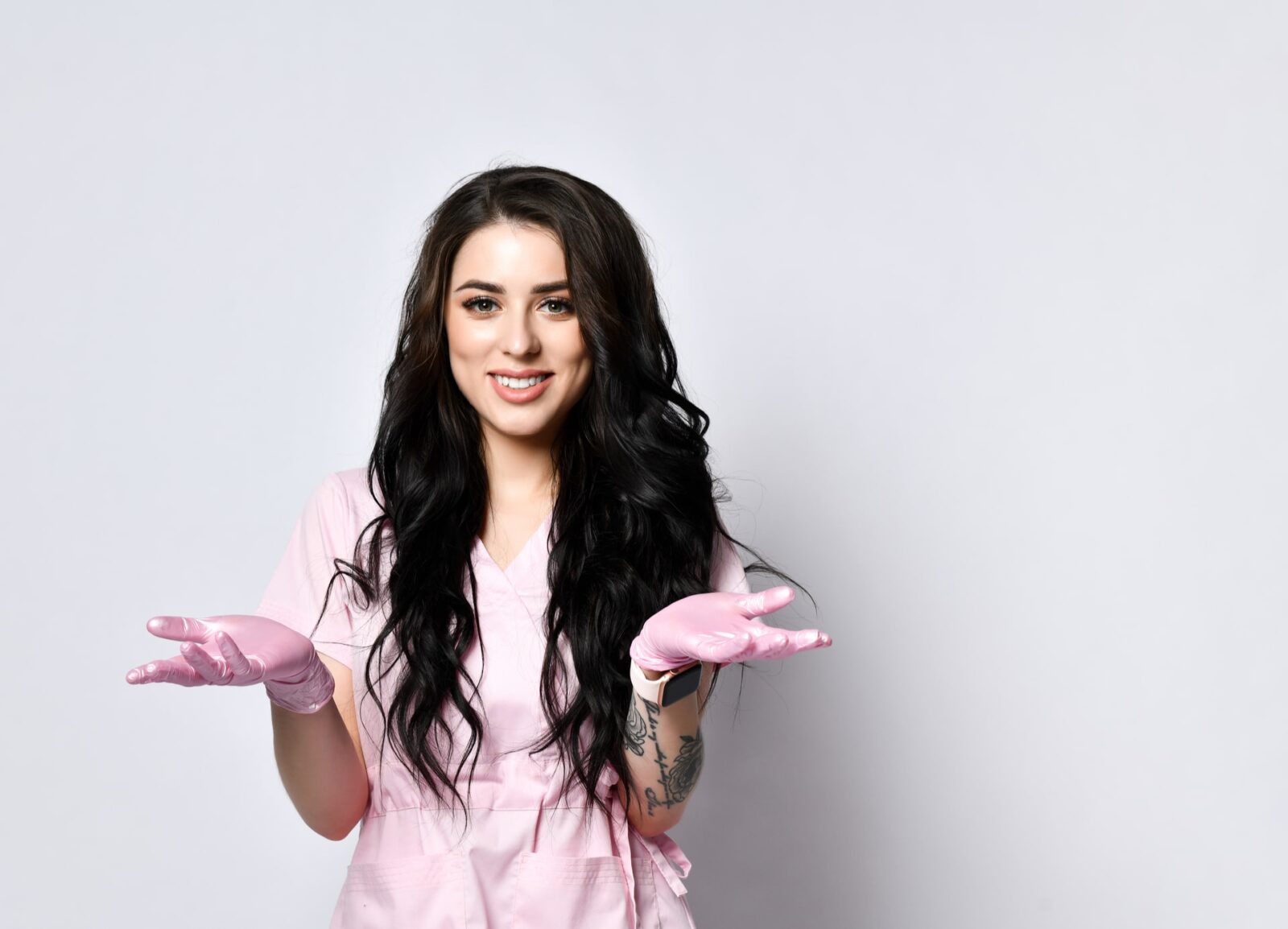 girl in pink scrubs and latex gloves