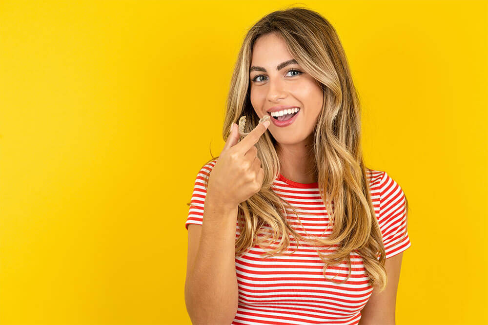 Young beautiful blonde woman wearing striped t-shirt