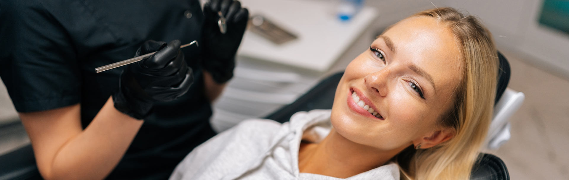 Charming young woman patient with perfect white teeth