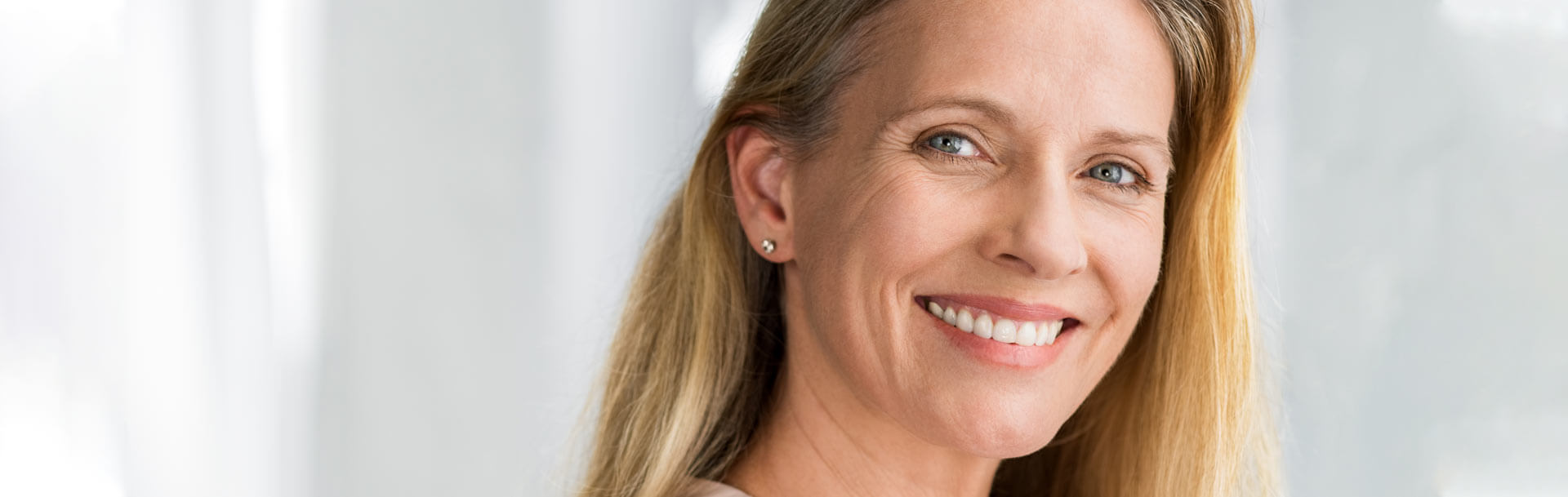 mature woman with toothy smile