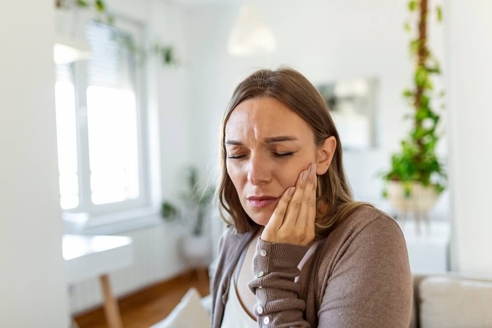 Young Woman Suffering From Terrible Strong Teeth Pain