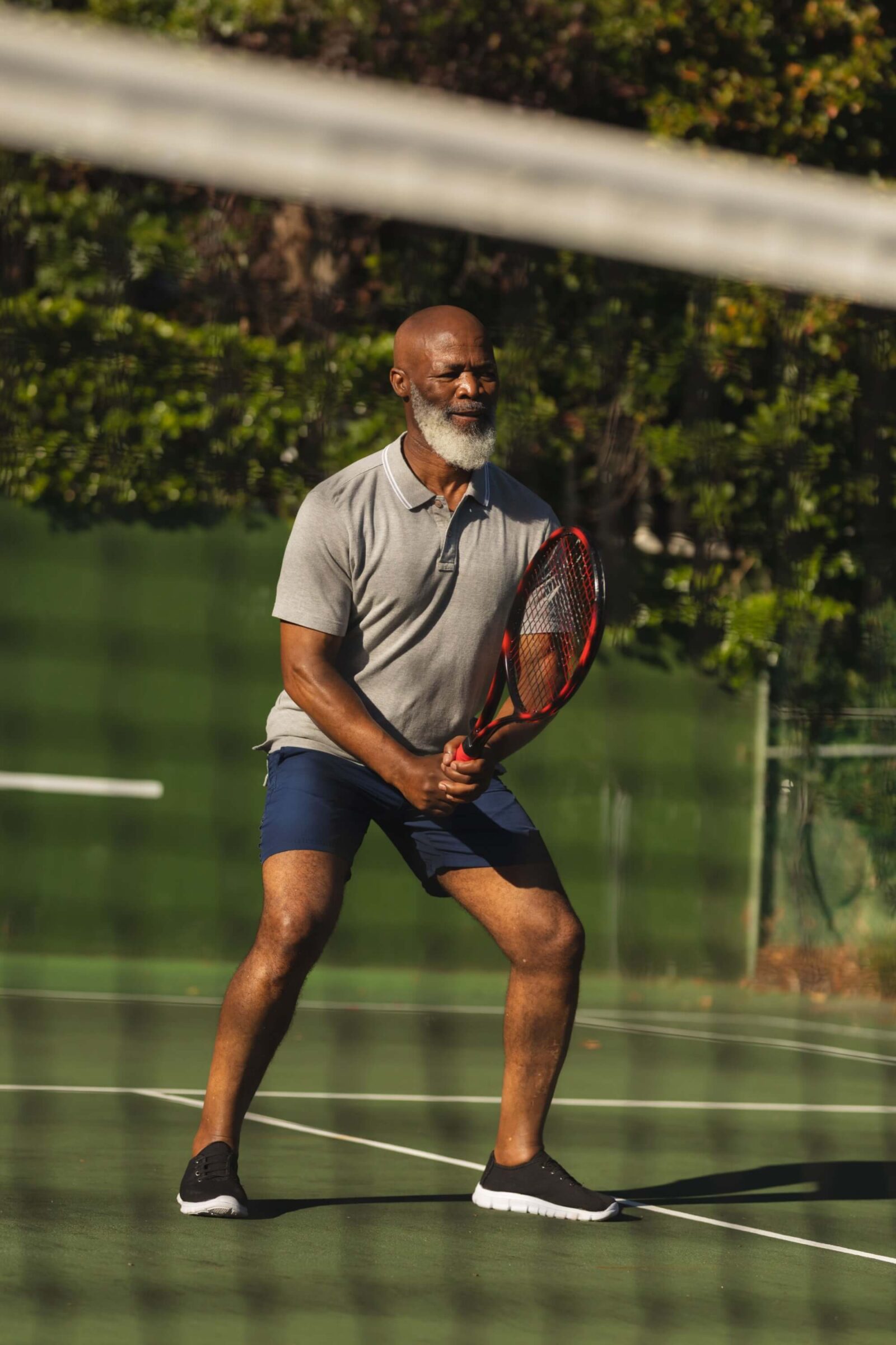 Senior african american man playing tennis