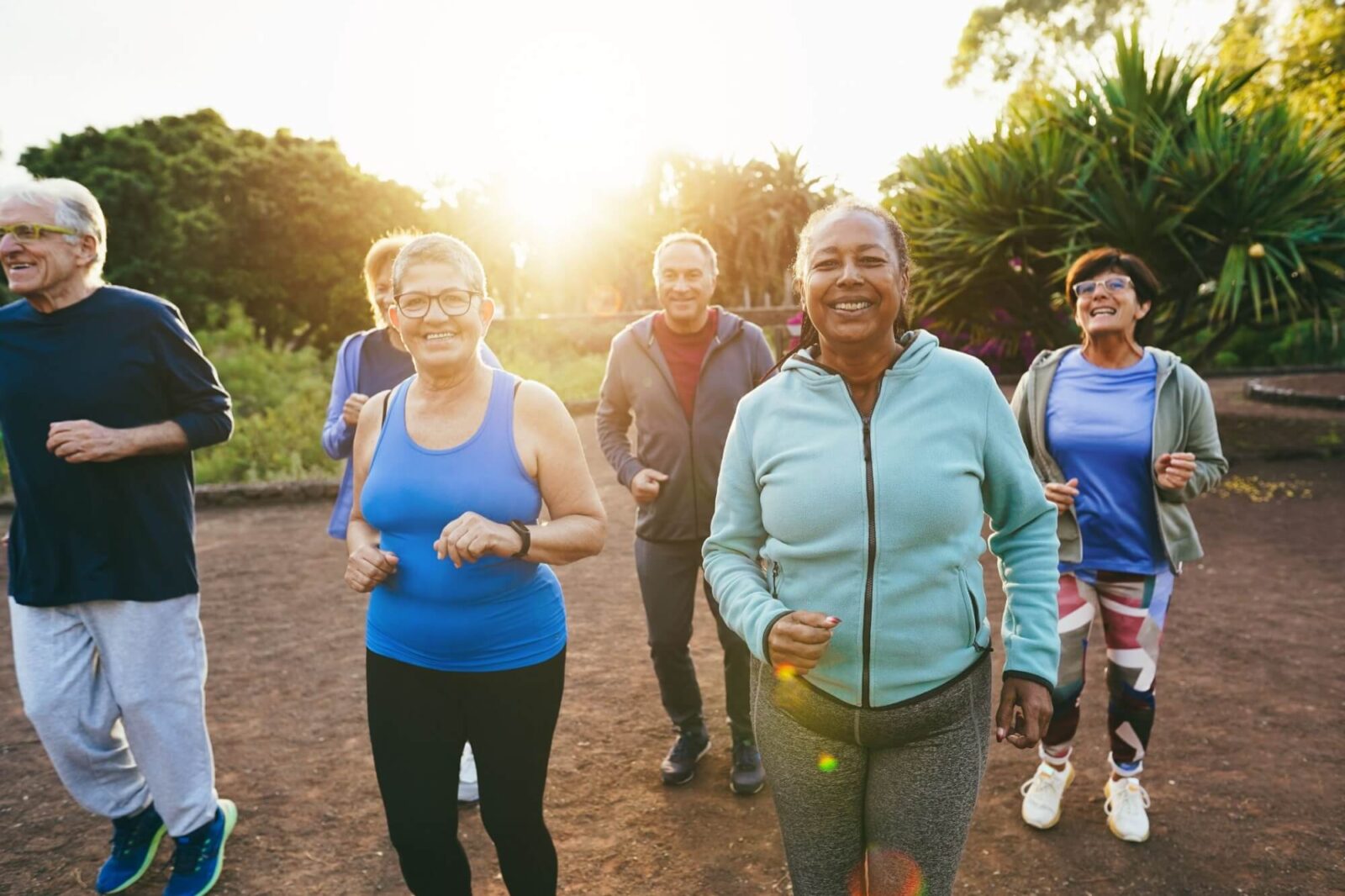 Fit senior people running at city park