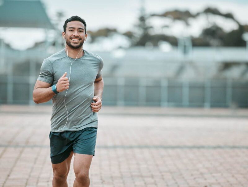 male athlete running with earphones