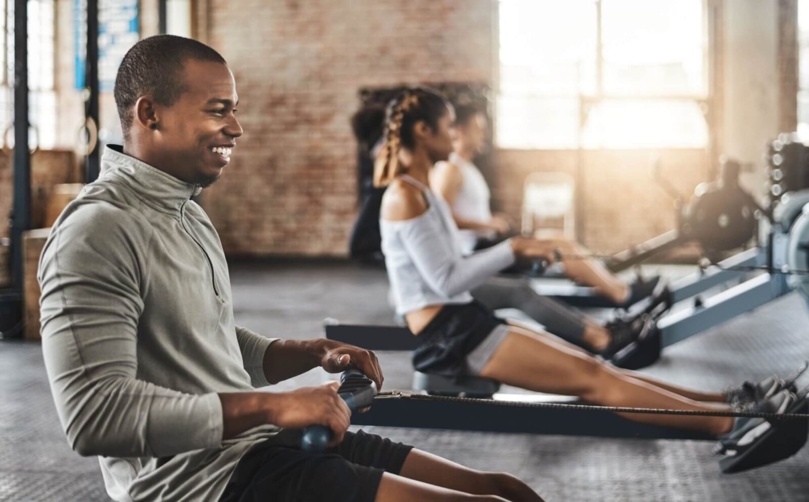 Man on rowing machine for exercise