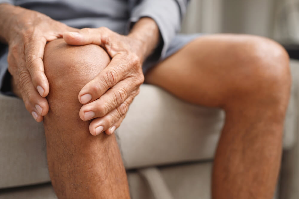 Man suffering stiffness in the knee