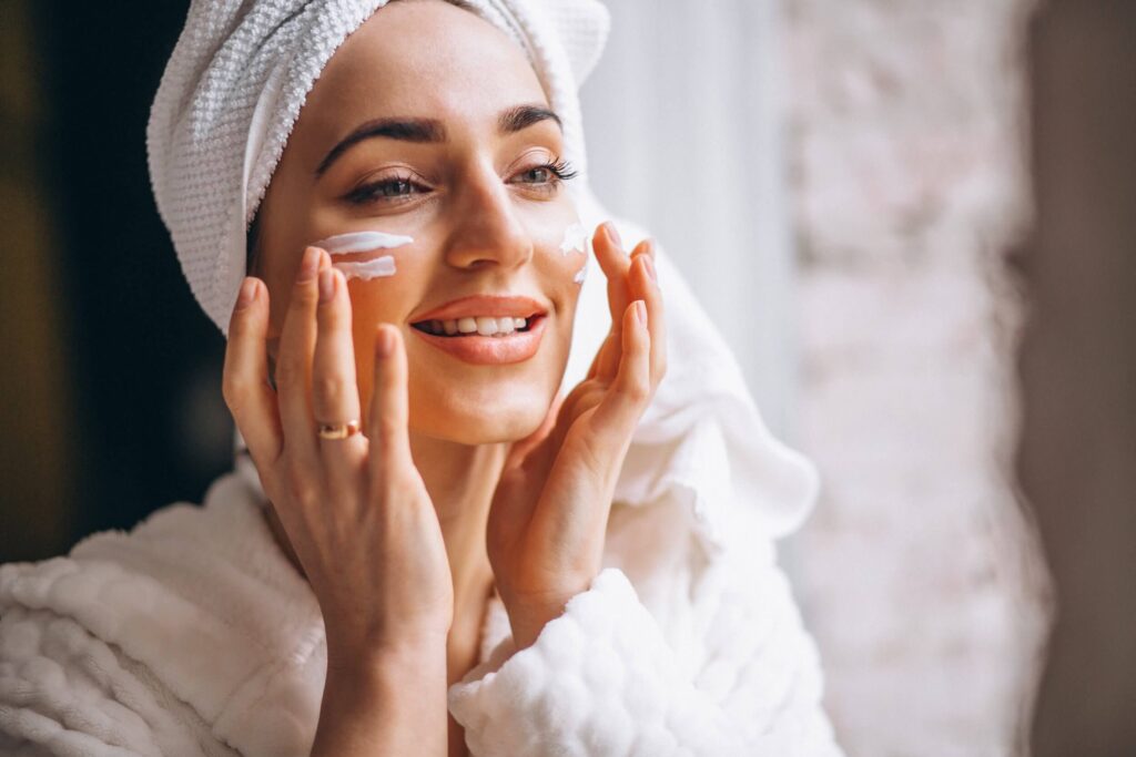 Woman applying facial product