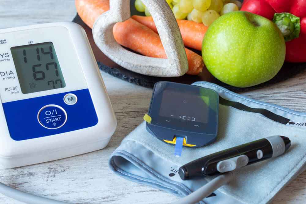 Devices for measuring blood pressure and blood glucose