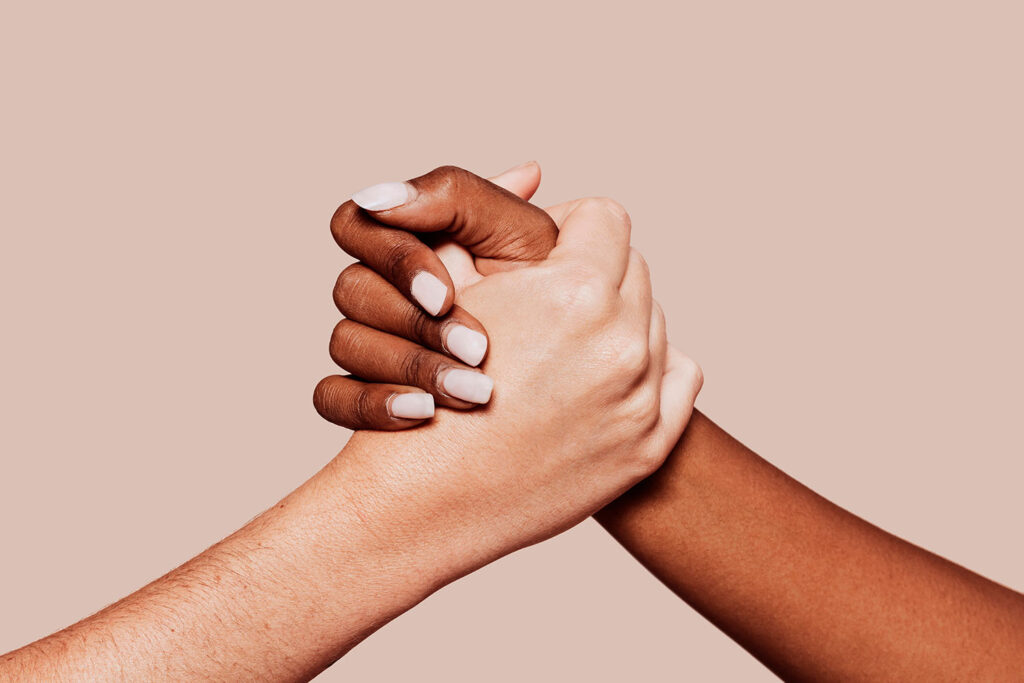 hands holding each other in tolerance unity and love