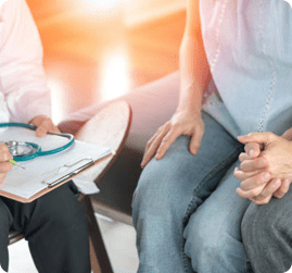 Doctor with man and women holding hand together