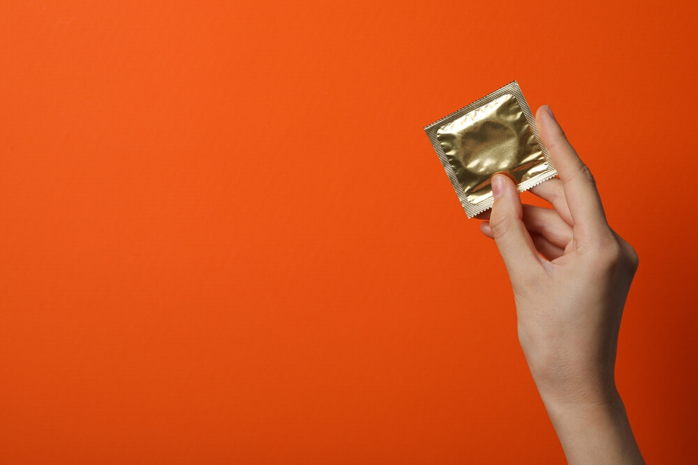 holding a condom
