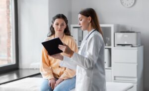 young adult patient speaking with provider