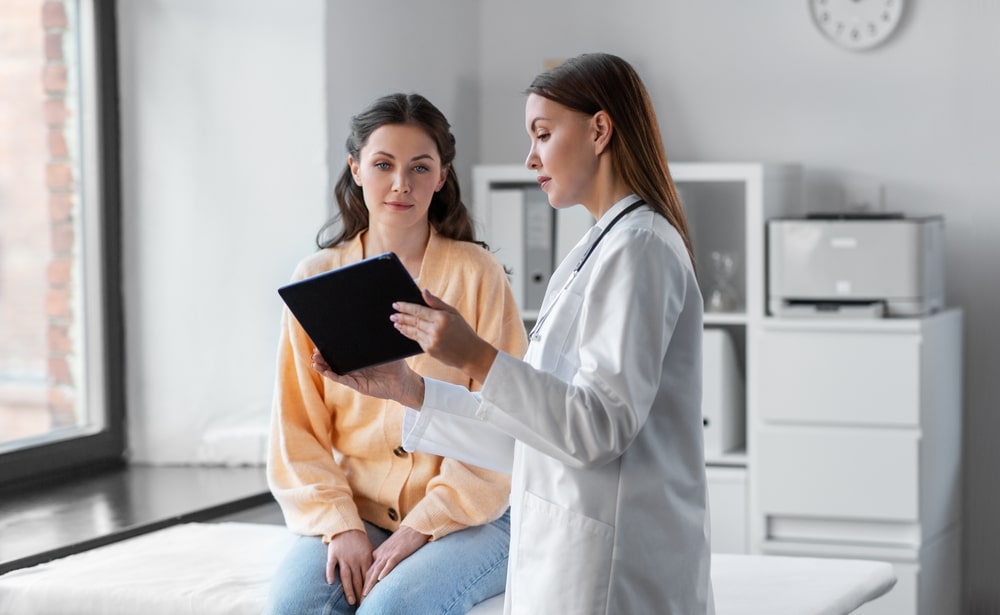 young adult patient speaking with provider