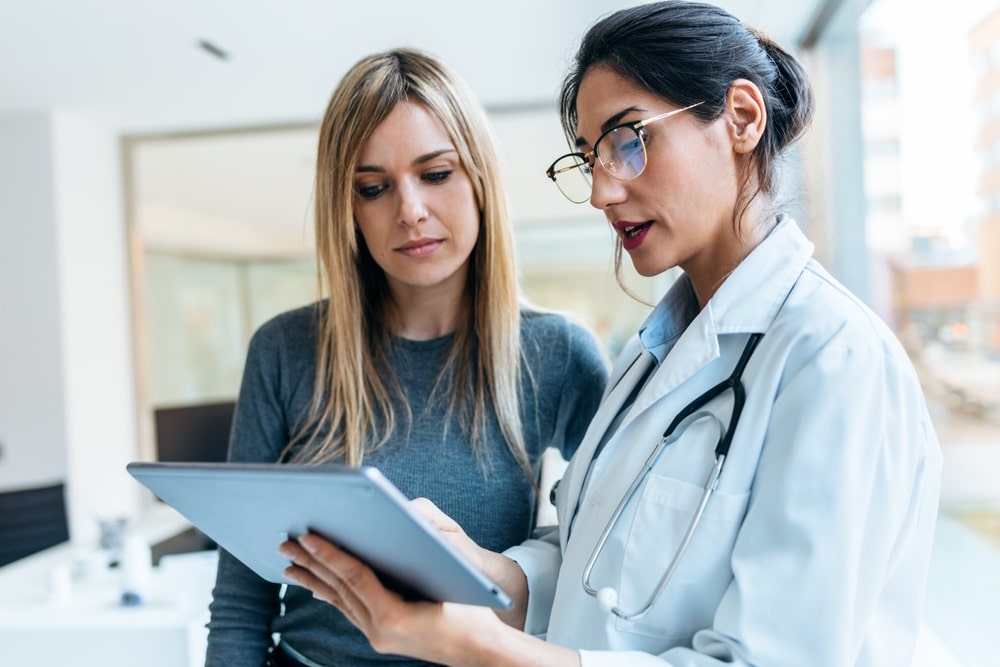 provider with patient discussing treatment