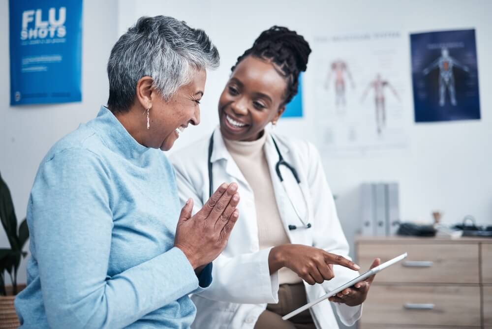 doctor and patient smiling together