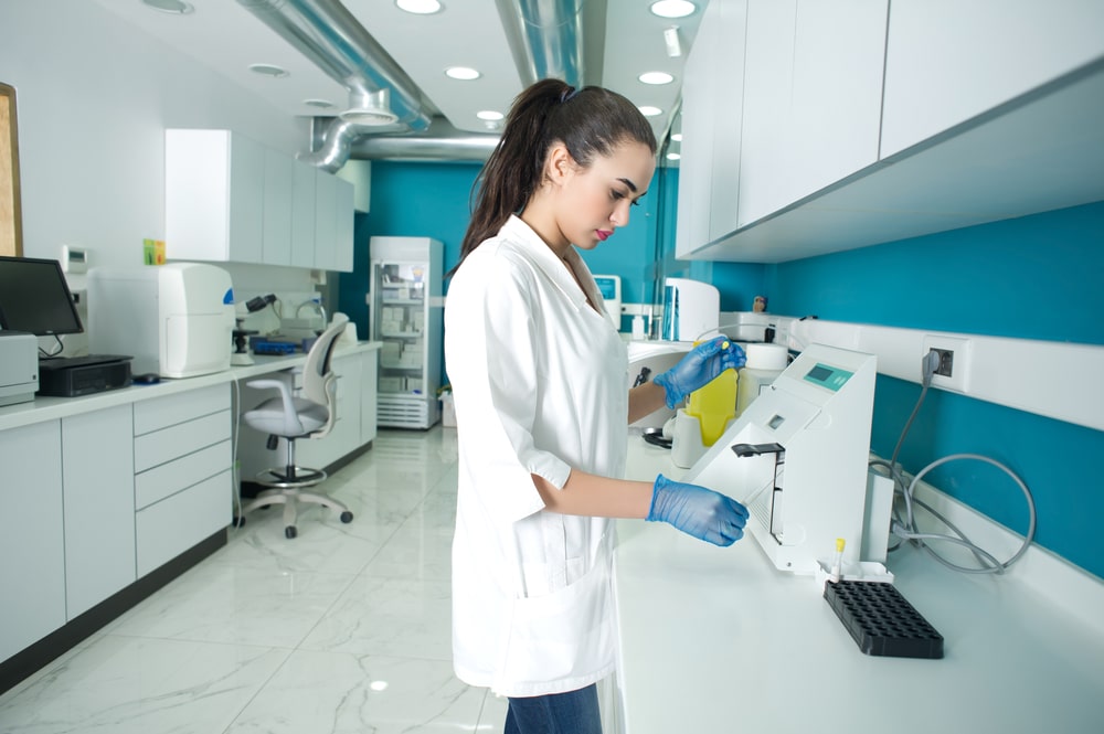 female scientist diagnosing blood in a lab