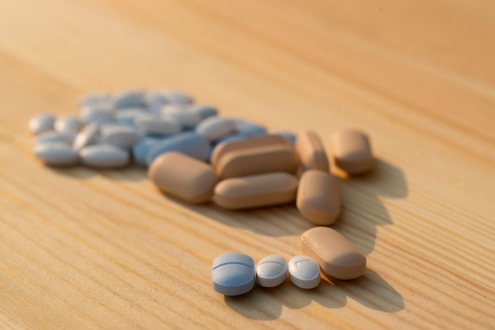 Antiretrovirals on wooden background, and light and shadow, Concept prevent HIV.