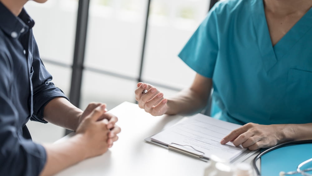 Healthcare Counsel Physician Giving Recommendations to Individual