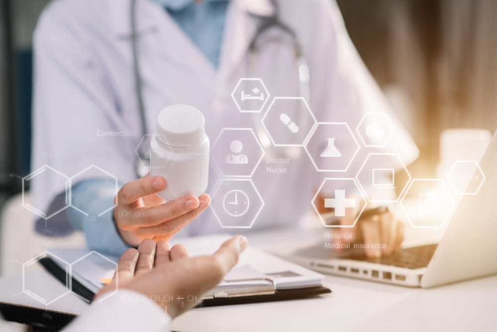 Young female therapist consulting male patient about pills.