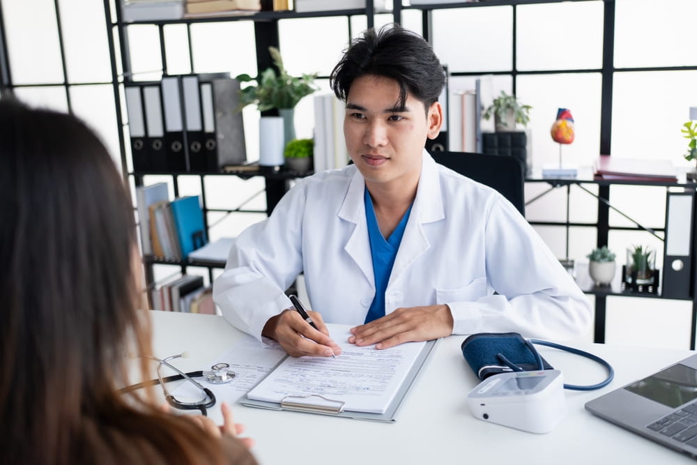 Healthcare. Doctor and patient are discussing interview consulting patient.