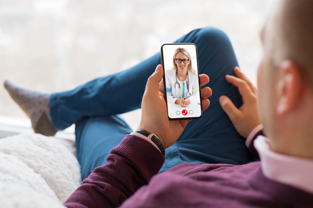 Man talking with doctor on video call