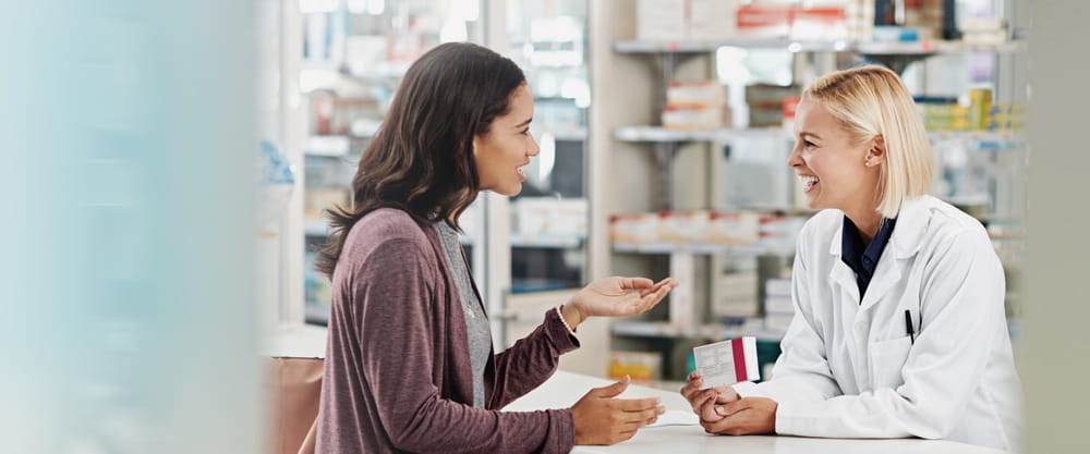 Medicine, client and consulting pharmacist by counter for pills side effects, prescription drugs dosage and advice