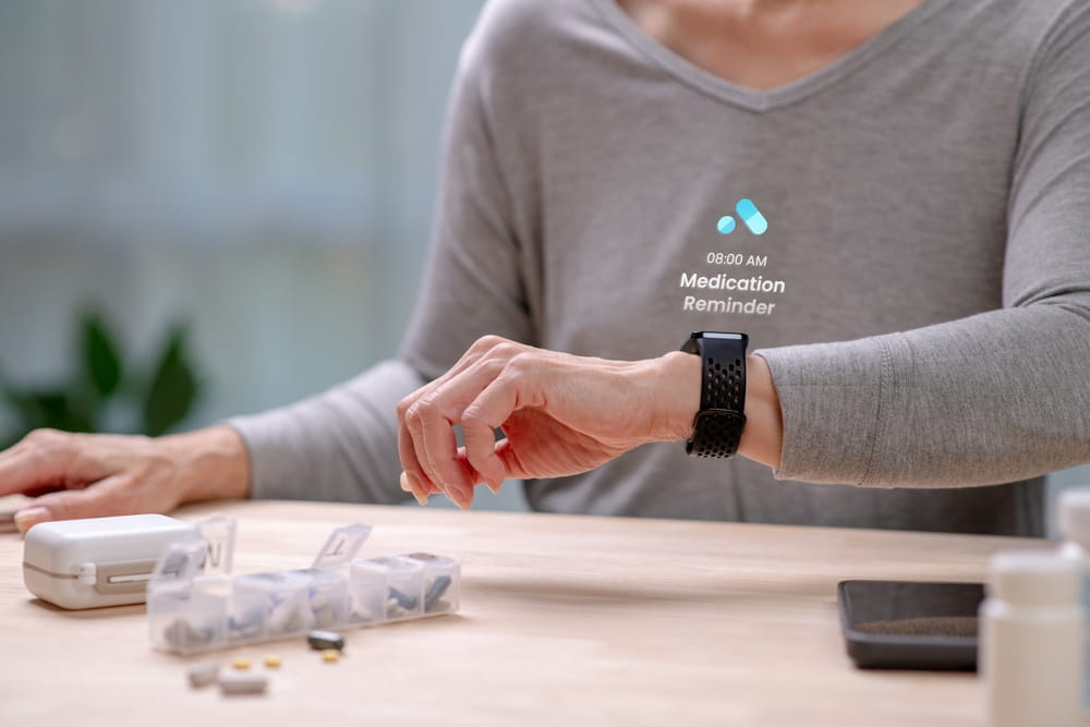Senior Asian Woman checking medication reminder on smartwatches , in concept of Augmented reality