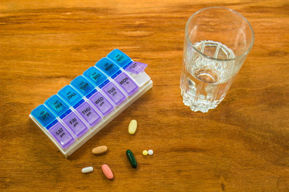Weekly Pill Box & Glass Of Water