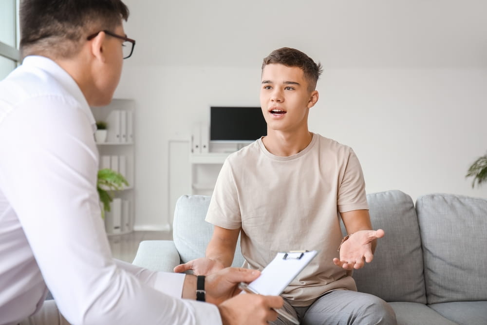 Teenage boy at psychologist's office