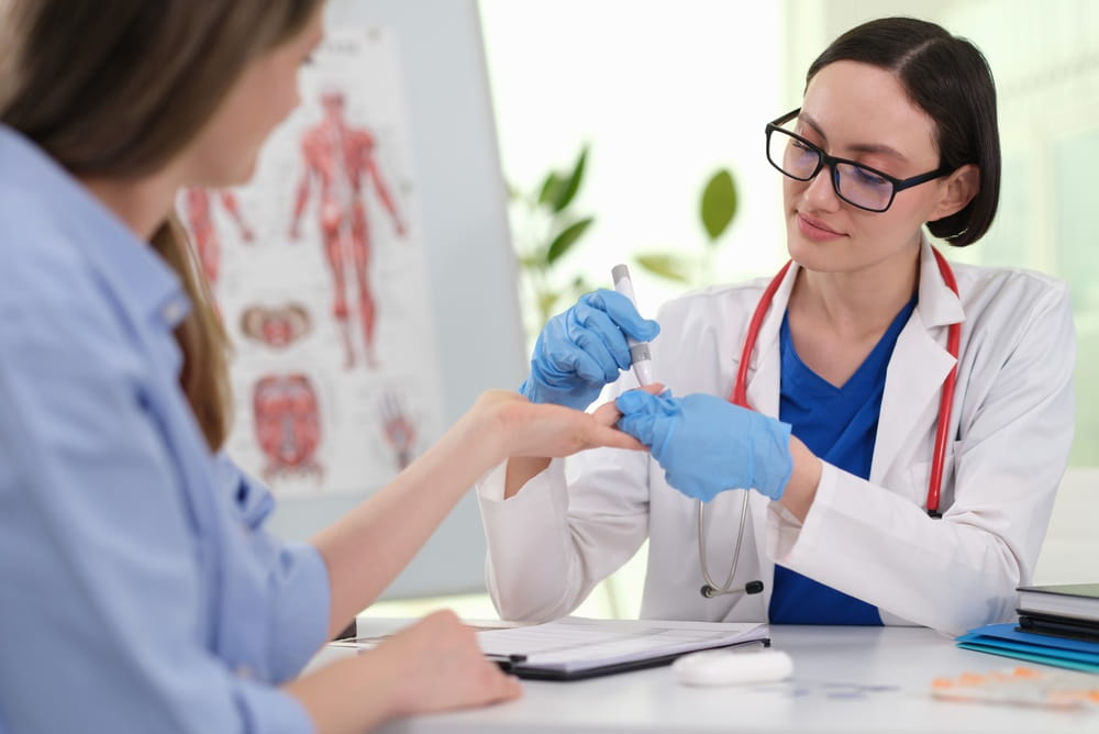 Clinician performing fingerstick blood glucose test, lancet and meter in use, immediate reading shown, diabetes monitoring