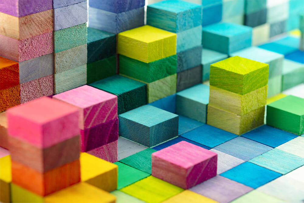 Spectrum of stacked multi-colored wooden blocks