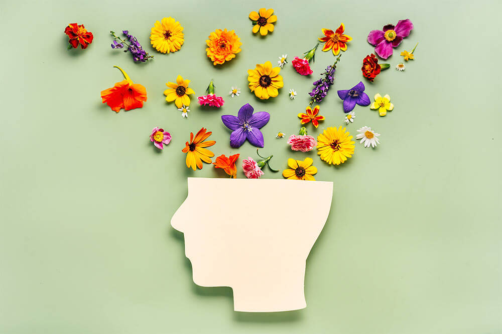 Human head symbol and flowers