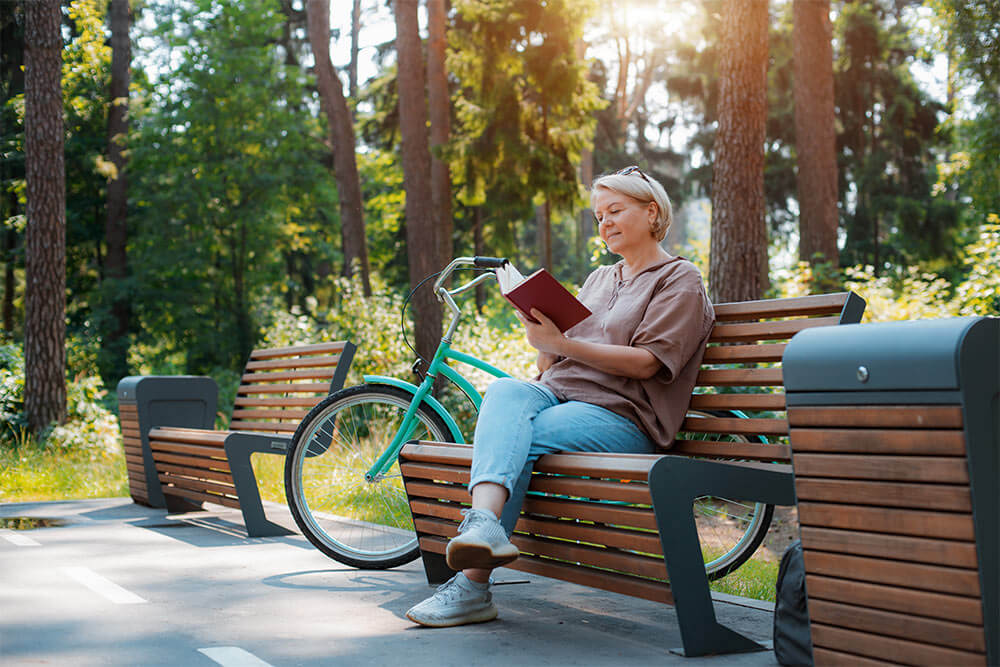 senior lady relaxing city park