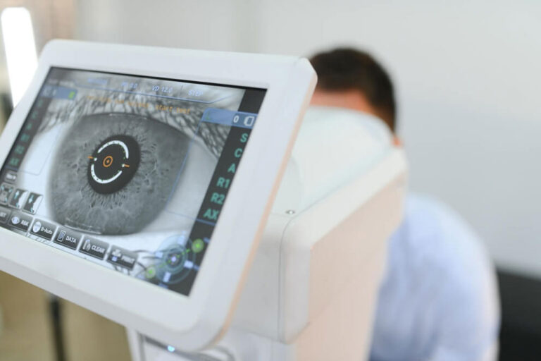 man is checking the eye vision in modern ophthalmology clinic